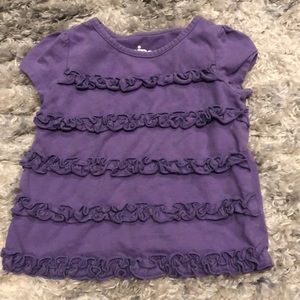 Purple ruffled shirt